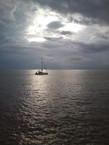 Catamaran crossing the tidal estuary